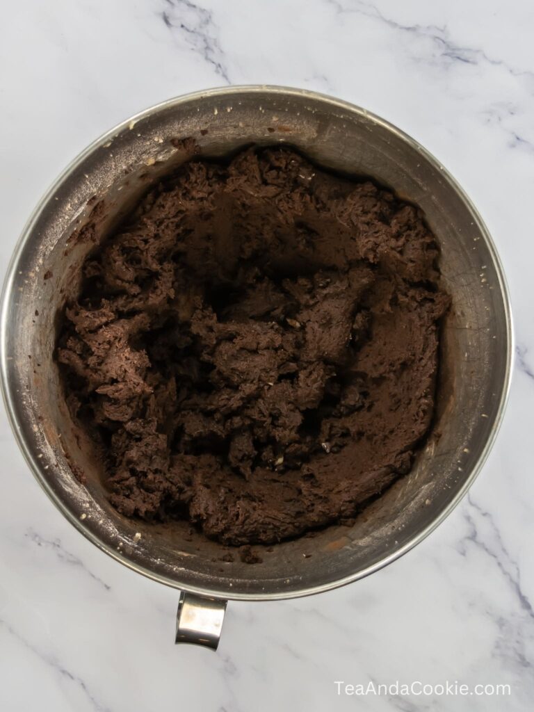 A bowl of dark chocolate cookie dough for cosmic brownie cookies