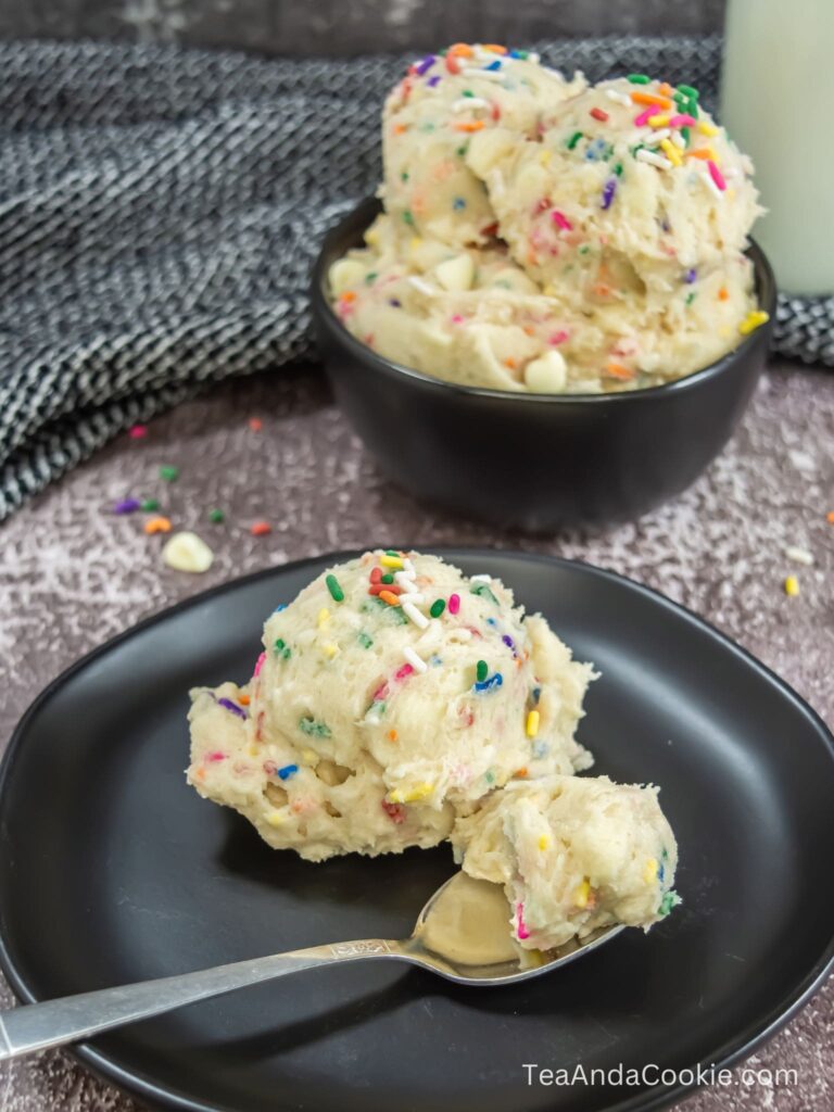 A plate with a scoop of funfetti edible cookie dough