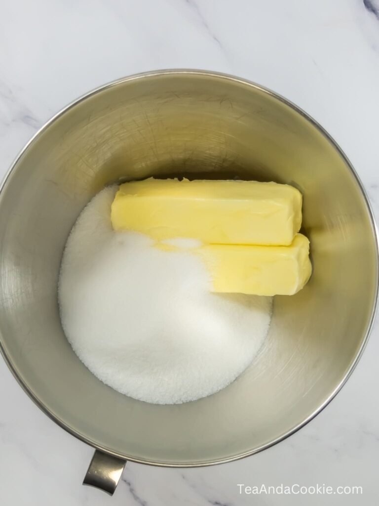 A bowl containing butter and sugar