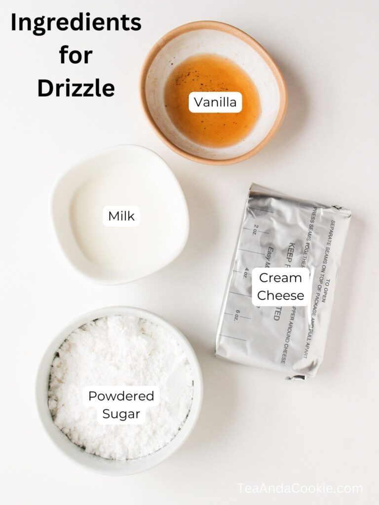 Four labeled bowls and containers with vanilla, milk, cream cheese, and powdered sugar on a white surface, captioned Ingredients for Drizzle.